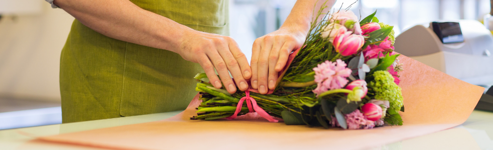 Florists creating custom floral arrangements and caring for flowers in their shops.