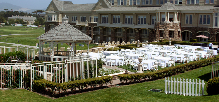 Estate wedding venue with outdoor ceremony and reception space overlooking landscaped grounds
