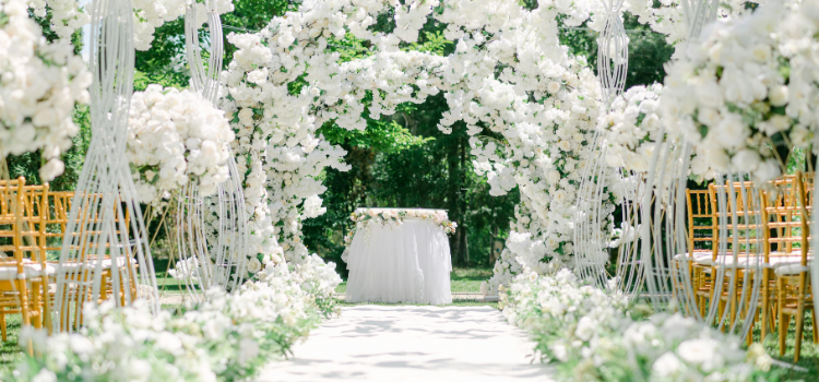 Luxury wedding ceremony space with white floral installations and elegant wedding décor