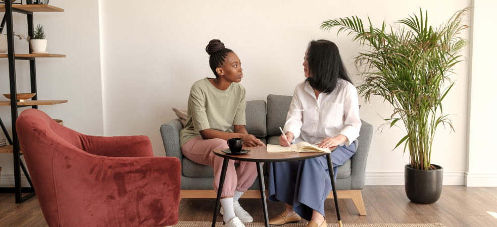 Therapist meeting with clients to discuss counseling services and mental health support