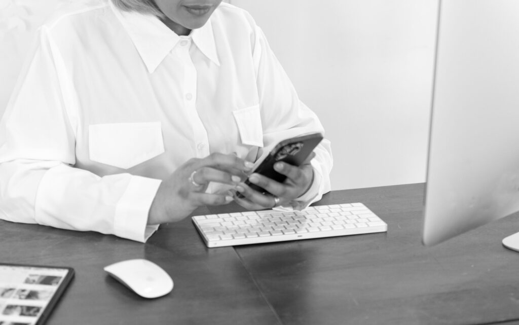 woman on computer working on her website so that it can show up on google