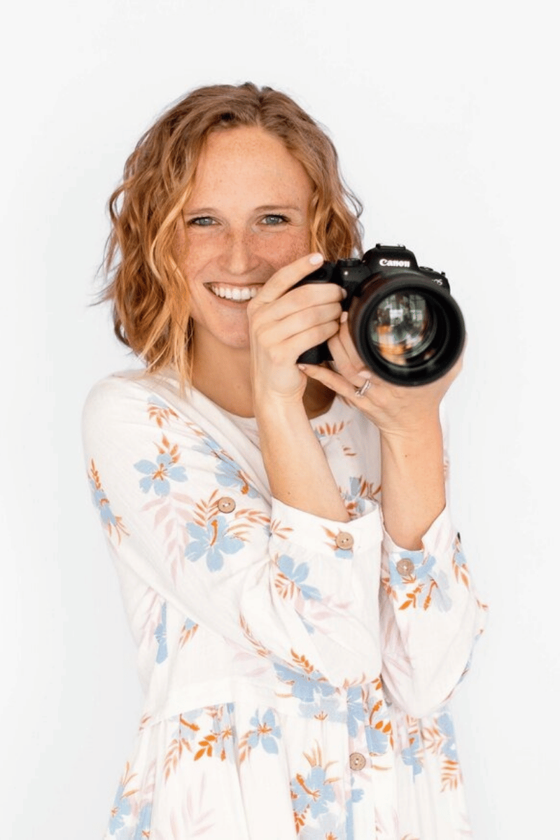 Brand photographer Kelly holding camera for Charlotte and Indianapolis photography business